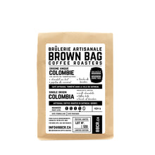 Load image into Gallery viewer, English description: Brown Bag Coffee Roasters - Bourbon Barrel Aged Colombia, 454 g bag | Description en français : la Brûlerie artisanale Brown Bag - Colombie vieilli en fût de bourbon, sac de 454 g